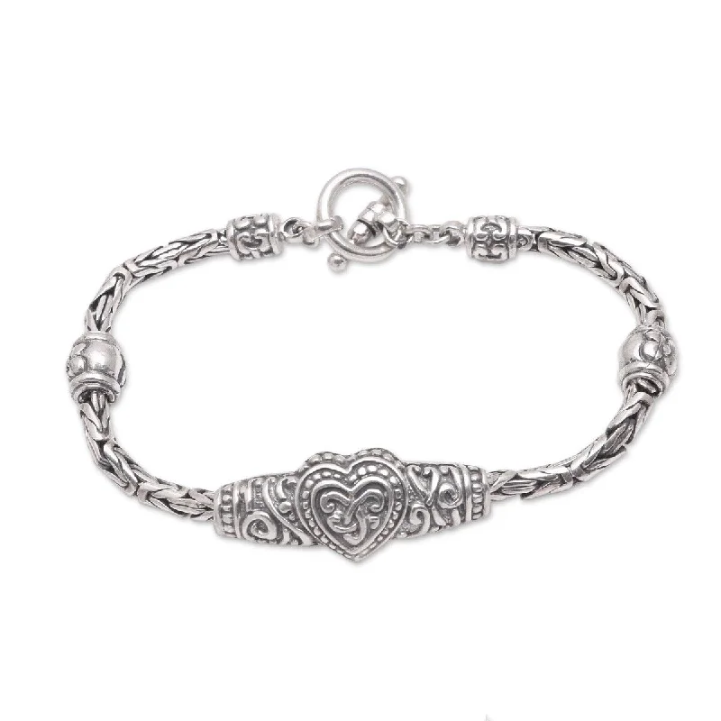 Bold charm bracelets  NOVICA Heart Knot, Sterling silver pendant bracelet