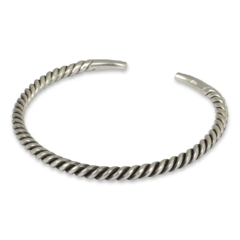 Anniversary gift bracelets  NOVICA Handmade Thai Swirl Tubular Stretched Coil of 925 Sterling Silver Mens Narrow Cuff Bracelet (Thailand)